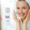 Woman applying BOC firming peptide serum to her skin