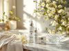 Beauty On Command skincare collection elegantly displayed with morning sunlight, fresh spring flowers, and crystal-clear water drops, arranged in order of application